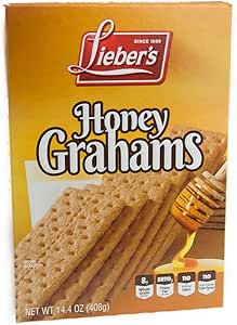 A stack of rectangular, light brown graham crackers with perforated lines and a sprinkling of brown specks on a white background.