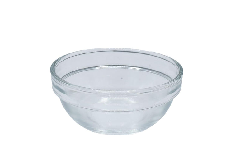 A clear plastic box containing a set of small glass bowls for a Seder plate, with a close-up of a single bowl shown.