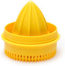 A yellow Jarware juicer lid attachment for a wide-mouth mason jar. It has a ridged reamer in the center and a strainer around the edge.