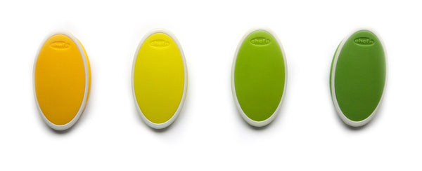 A set of four oval, plastic bag sealing clips in a tonal gradient of green and yellow colors. 