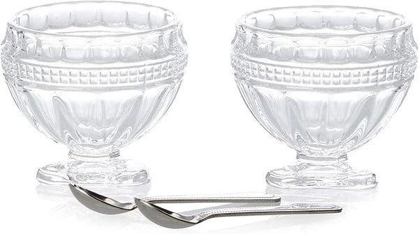 Elegant Godinger salt and pepper cellars with matching spoons on a white background.