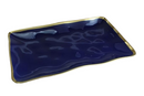 Blue rectangular porcelain platter with vibrant gold-tone rim on a white background.