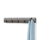 Grey pewter Umbra Flip 5 Hook wall-mounted coat rack with retractable hooks on a white background.