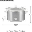 Silver 4-quart Hamilton Beach slow cooker with black handles and glass lid on white background.