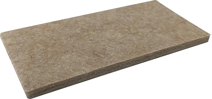 beige 2-inch by 4-inch heavy-duty felt furniture pads on a white background.