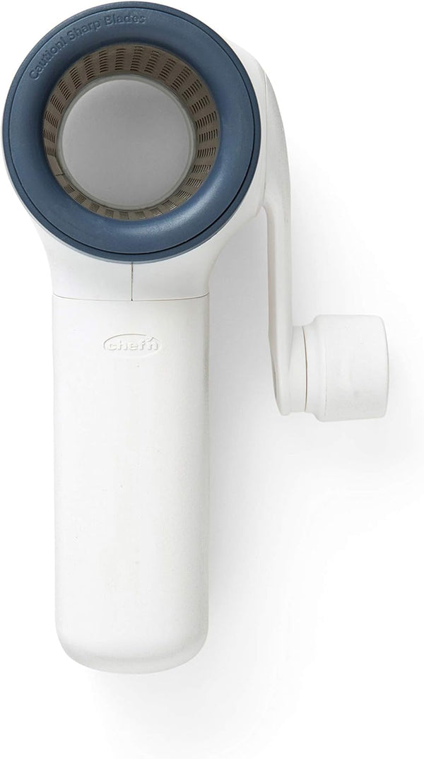 Chef'n spring-loaded rotary grater in white with blue accents, shown with a removable grating drum, designed for easy cheese grating.