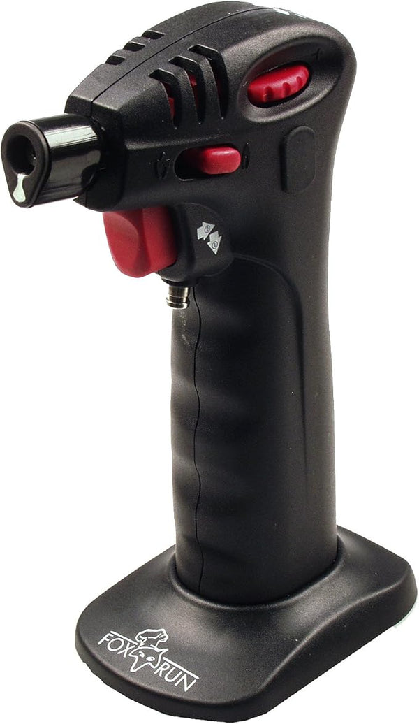Black Fox Run butane kitchen torch with ergonomic design and detachable stand on a white background.