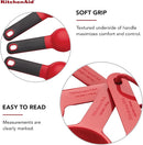 KitchenAid 9-piece red measuring cups and spoons set with soft grip handles.