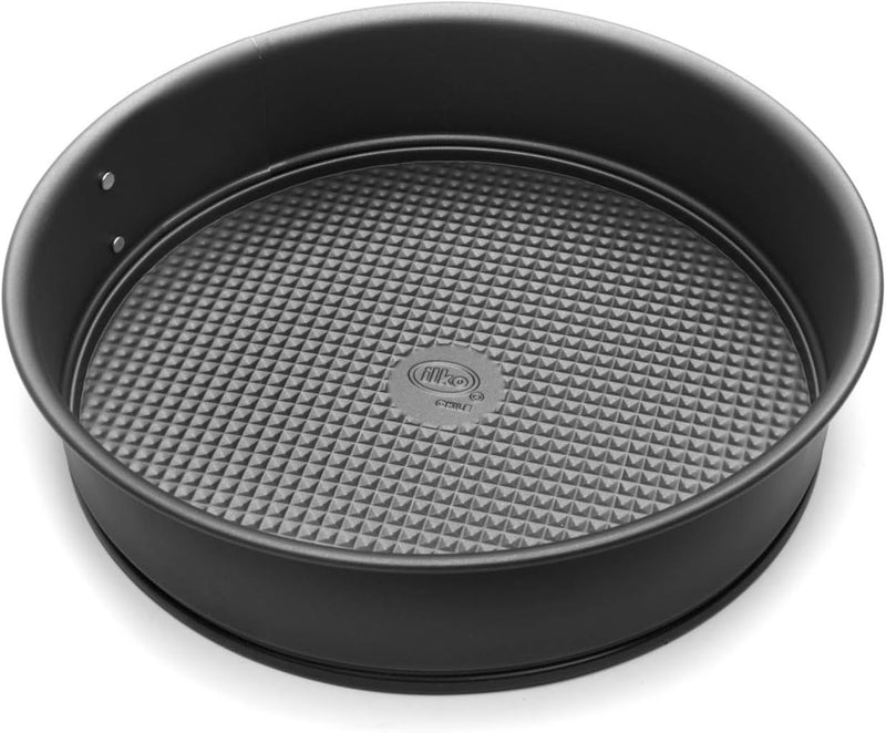 A silver, non-stick 10-inch springform cake pan with a quick-release latch.