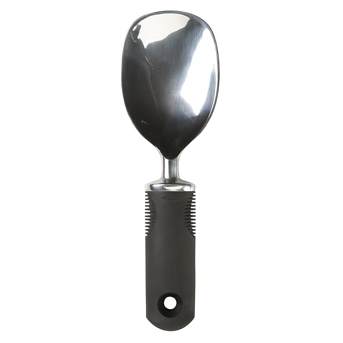 OXO Good Grips Ice Cream Spade with wide aluminum blade and soft black non-slip handle on a white background.
