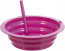 A colorful collapsible silicone bowl in pink with straw