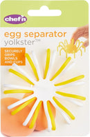 Chef'n Yolkster egg separator packaging, showing two white and yellow spiky egg separators, with text highlighting "securely grips bowls and cups," "BPA free," and "dishwasher safe."