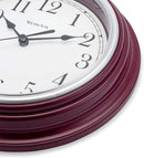 9-inch round burgundy wall clock with large analog display on a white background.