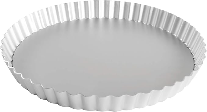Fat Daddio's 9.5-inch round fluted tart pan made of anodized aluminum, ideal for baking tarts, pies, and quiches, on a white background.