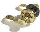 A pair of polished brass door knobs. The knobs have a curved lever design and are for an interior non-locking passage door.