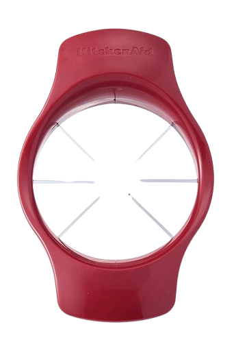 A red apple slicer and corer tool with a plastic handle and eight stainless steel blades radiating from the center. 