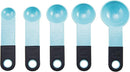 A set of nine light blue KitchenAid measuring cups and spoons with black soft-grip handles, spread out on a white surface. The set includes four cups and five spoons.