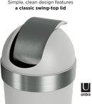 Close-up of curved stainless steel swing-top lid