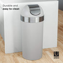 Grey trash bin placed in kitchen with wood flooring