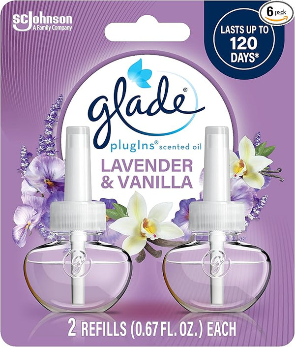 Two Glade PlugIns scented oil refills in Lavender & Vanilla scent, featuring transparent bottles with purple-tinted oil and lavender-themed labeling, shown on a white background.