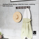 Grey pewter Umbra Flip 5 Hook wall-mounted coat rack with retractable hooks on a white background.