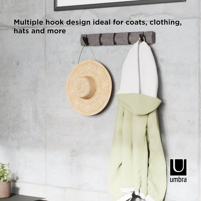 Grey pewter Umbra Flip 5 Hook wall-mounted coat rack with retractable hooks on a white background.
