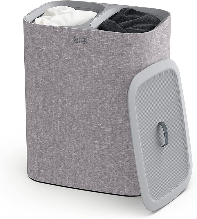 Joseph Joseph Total 90-liter laundry hamper in grey with two removable bags and lid, shown on a white background.