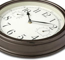 A 12-inch Westclox indoor/outdoor wall clock with a bronze frame, featuring an analog display with a temperature gauge and a humidity gauge.