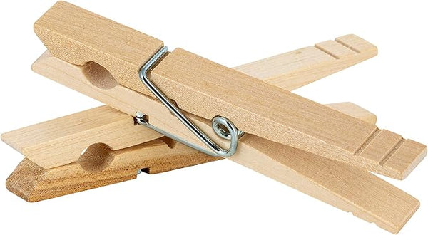 natural birch wooden clothespins on a white background.