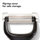 OXO Good Grips julienne peeler with stainless steel blade and soft non-slip handle on a white background.