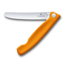 A bright orange Victorinox foldable knife with a serrated stainless steel blade shown partially open. The handle has an ergonomic shape.
