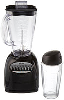 Close-up of Sunbeam Oster blender with push-button speed panel and included travel bottle