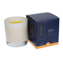 Trapp No. 4 Orange Vanilla 7 oz. Signature Candle in a frosted white glass container, placed next to its navy and orange packaging.