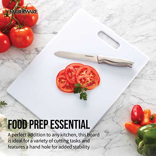 White Farberware cutting board with sliced tomatoes and a knife, showing smooth and durable surface.