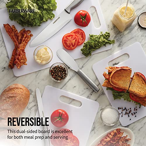 Assortment of white Farberware cutting boards shown in use with sandwiches, vegetables, and condiments.