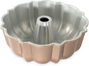 Nordic Ware toffee-colored classic Bundt pan with fluted edges and a center tube on a white background.