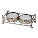 A boxed set featuring a shiny, rectangular, nickel-plated metal frame holder designed for two mini tealight candles, with two white tealights included.