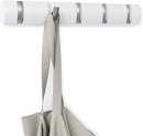  modern white wall-mounted coat rack with five silver colored retractable hooks.