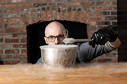 Person using Babish stainless steel tongs over a steaming pot in a rustic kitchen setting