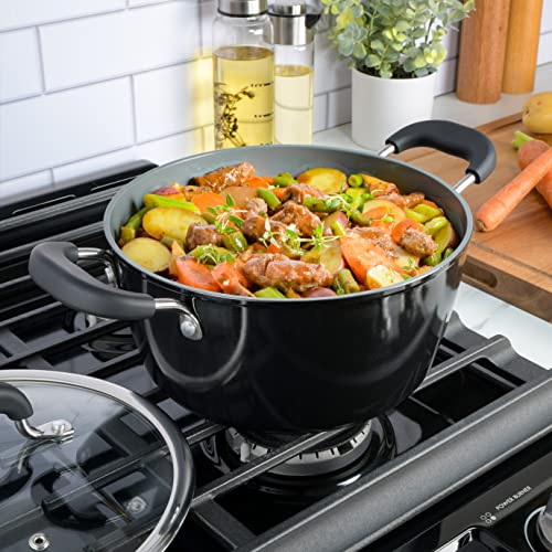 Dutch oven on a stove filled with vegetables and stew
