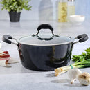 Kenmore Dutch oven sitting on a countertop surrounded by fresh ingredients