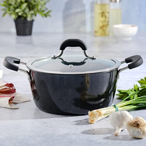 Kenmore Dutch oven sitting on a countertop surrounded by fresh ingredients