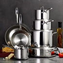 A 12-piece cookware set made of highly polished stainless steel, including various saucepans, frying pans, and a stockpot, all with matching stainless steel lids and handles.
