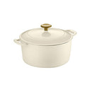 A round, creamy white enameled cast iron Dutch oven with matching lid and a contrasting matte gold-colored knob.