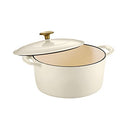 A round, creamy white enameled cast iron Dutch oven with matching lid and a contrasting matte gold-colored knob.