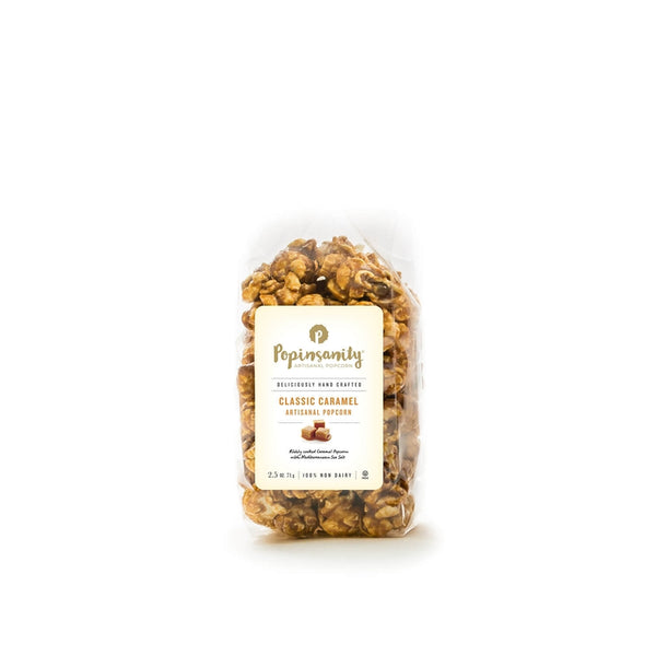 A bag of Popinsanity Classic Caramel Artisanal Popcorn, showcasing rich caramel-coated popcorn with a golden crunch, made with premium ingredients and perfect for gifting or personal enjoyment.