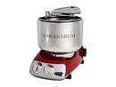 Premium Ankarsrum Original kitchen machine with a vibrant red base and large, polished stainless steel mixing bowl, ideal for baking and food preparation. This durable stand mixer features chrome accents and a front control panel with two dials for easy operation.