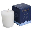 Trapp No. 20 Water 2 oz. Votive Candle in a simple white wax form, displayed next to its navy and light blue packaging.