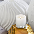 Lifestyle image of the Trapp No. 20 Water Signature Candle lit in a decorative setting, surrounded by modern home decor.
