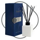 Trapp No. 77 Palo Santo 4 fl. oz. Reed Diffuser Kit featuring a sleek white square glass bottle with black reeds, displayed next to its navy and gray packaging.